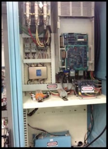 A view of an electrical panel with wires and other equipment.